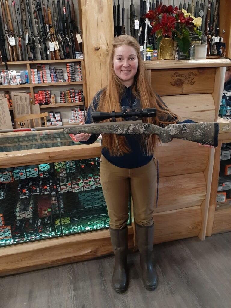 Hana displaying Winchester XPR 6.5 PCR with scope